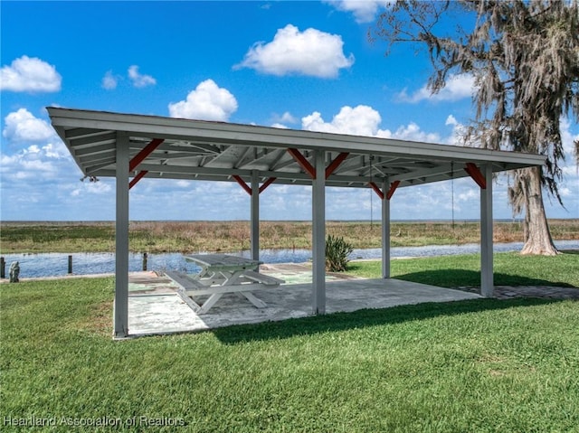 exterior space with a water view, a lawn, and a gazebo