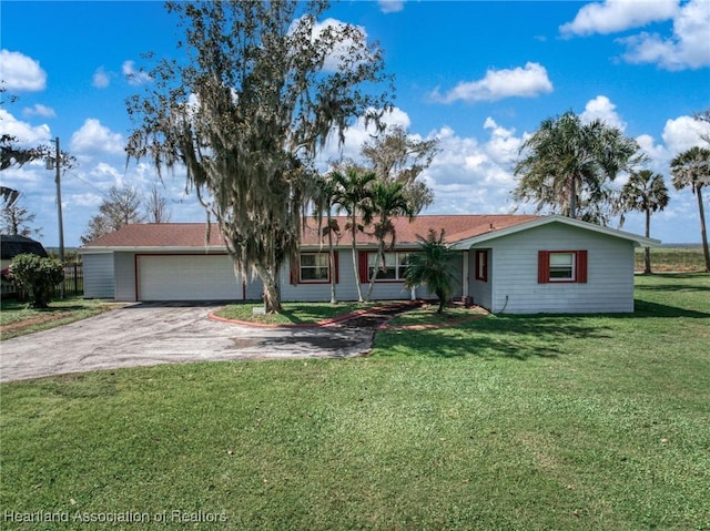 ranch-style house featuring aphalt driveway, a front lawn, and an attached garage
