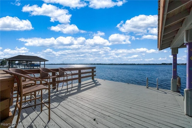 dock area featuring a gazebo and a water view