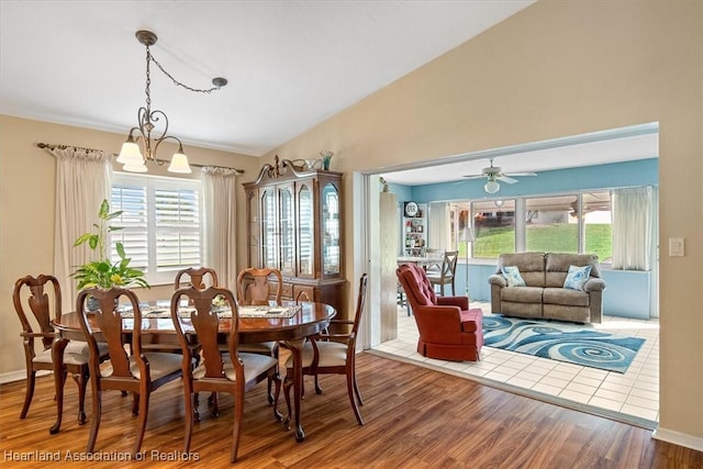 dining area featuring lofted ceiling, hardwood / wood-style floors, and a wealth of natural light