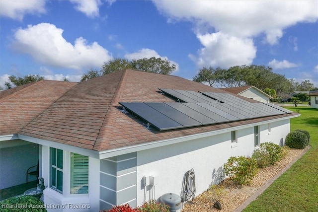 view of home's exterior with solar panels