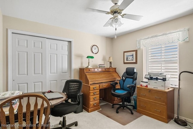 office with light carpet and ceiling fan