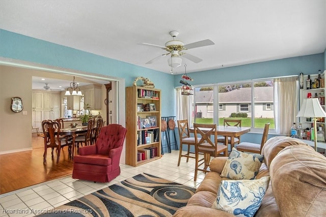 living room featuring ceiling fan and light tile patterned floors