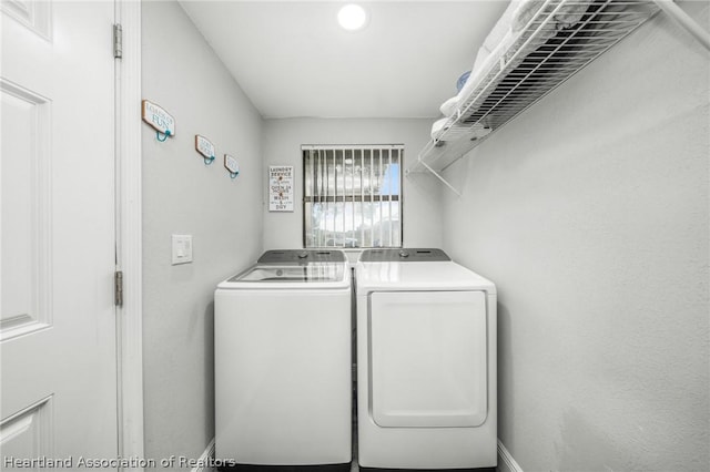 washroom with washing machine and dryer