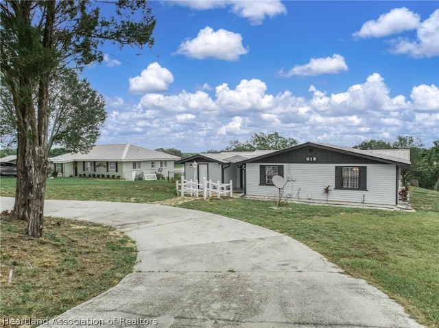 ranch-style house with a front lawn