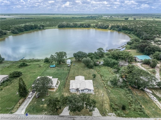 birds eye view of property featuring a rural view and a water view