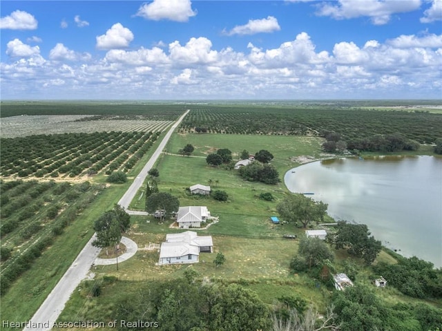 drone / aerial view with a rural view and a water view