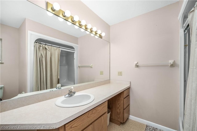 bathroom featuring vanity and a shower with shower curtain