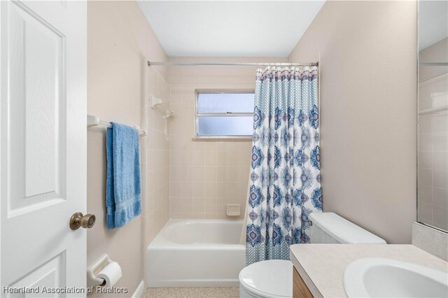 full bathroom with vanity, toilet, and shower / bathtub combination with curtain