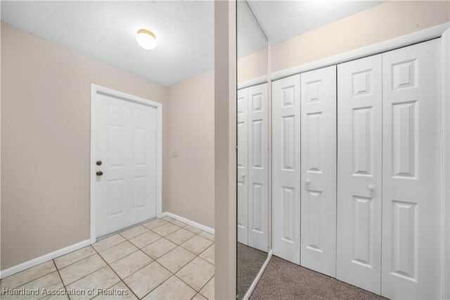 entrance foyer featuring light tile patterned floors