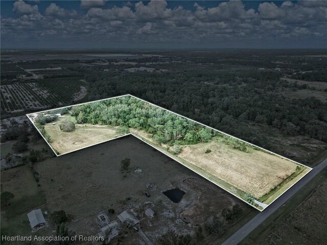 birds eye view of property featuring a rural view