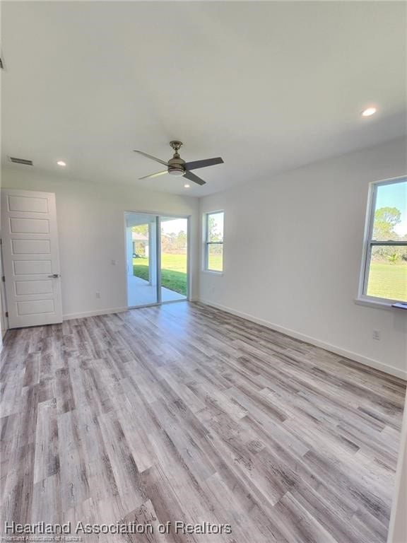 4983 San Lorenzo Dr, Sebring, FL 33872 - spare room with visible vents, baseboards, recessed lighting, a ceiling fan, and light wood-type flooring