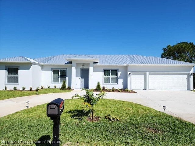 4983 San Lorenzo Dr, Sebring, FL 33872 - view of front of home featuring a front yard, concrete driveway, stucco siding, an attached garage, and metal roof