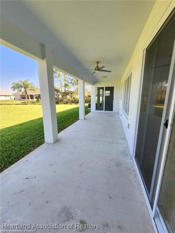 4983 San Lorenzo Dr, Sebring, FL 33872 - view of patio featuring a ceiling fan