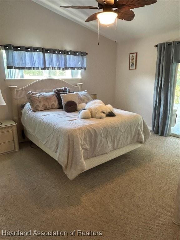 carpeted bedroom with lofted ceiling and ceiling fan