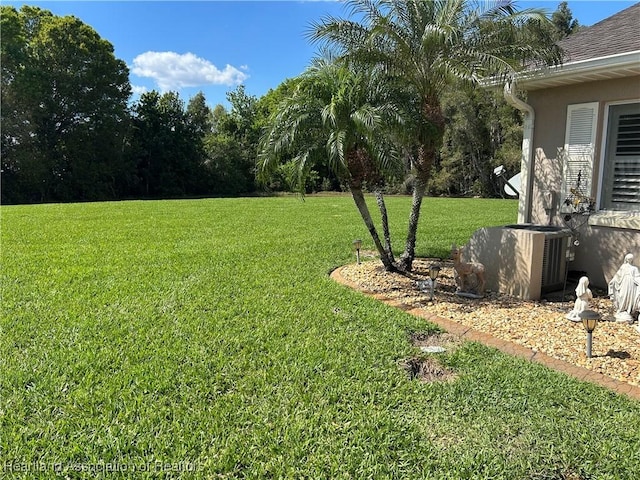 view of yard featuring central AC unit