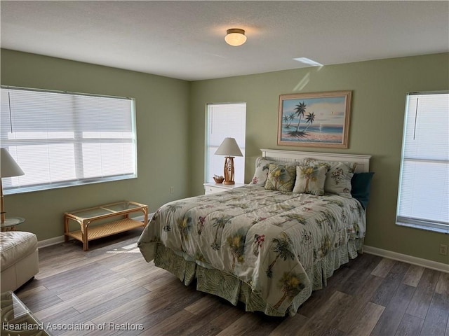 bedroom with hardwood / wood-style floors