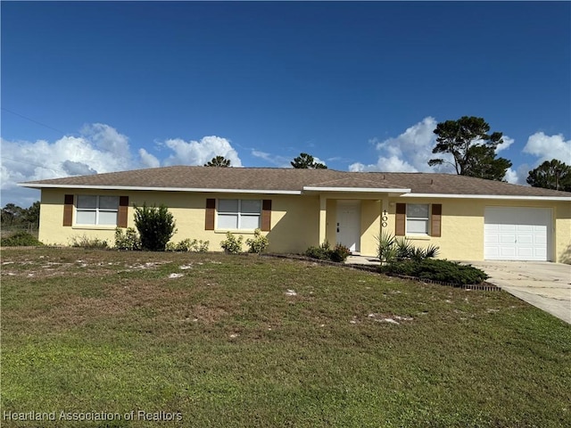 ranch-style house with a garage and a front lawn