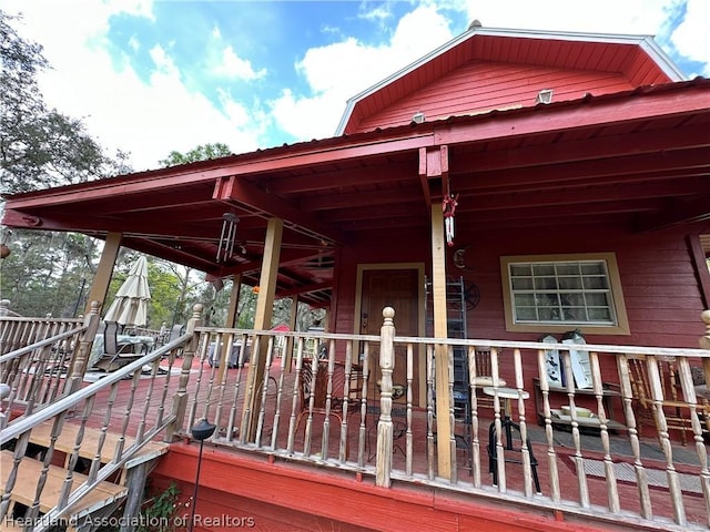 wooden terrace with a porch