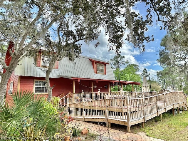 rear view of property with a deck