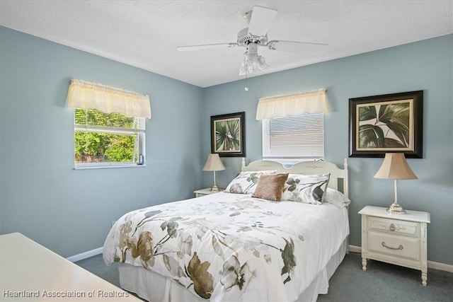 bedroom with carpet flooring, a ceiling fan, and baseboards