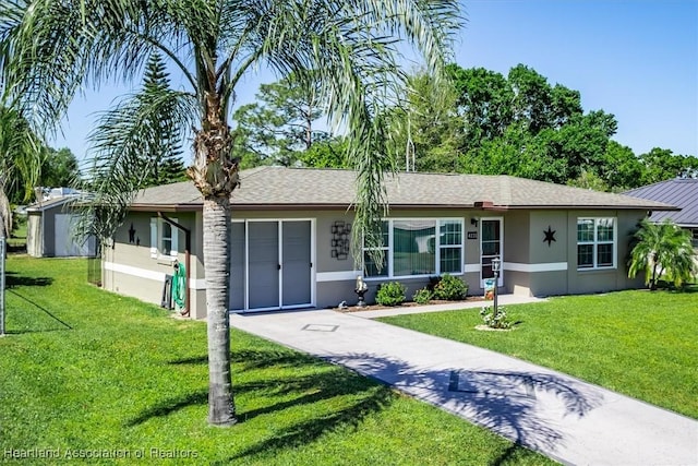 ranch-style house featuring concrete driveway, a front lawn, a garage, and stucco siding