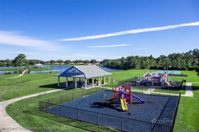 community playground featuring a gazebo, a water view, a yard, and fence