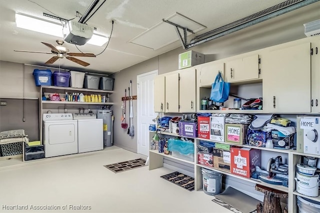 garage with a ceiling fan, a garage door opener, independent washer and dryer, and electric water heater