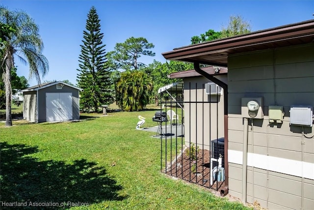 view of yard featuring an outbuilding and a storage unit