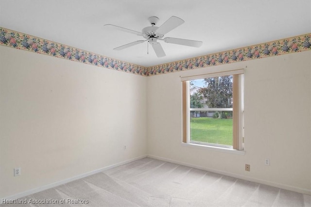 unfurnished room with carpet and ceiling fan