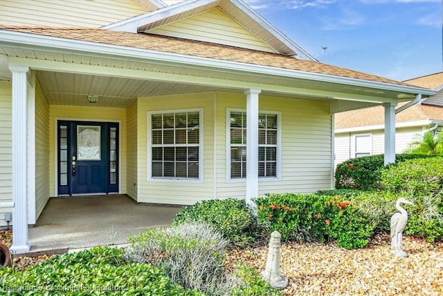 doorway to property with a porch