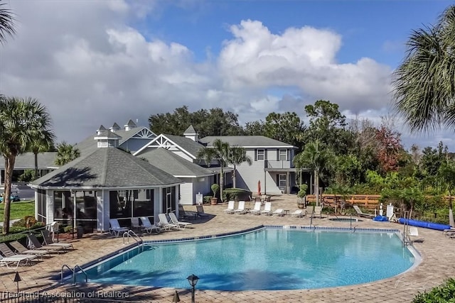 view of swimming pool with a patio