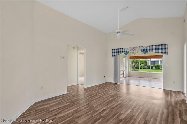 unfurnished living room featuring hardwood / wood-style floors, ceiling fan, and lofted ceiling