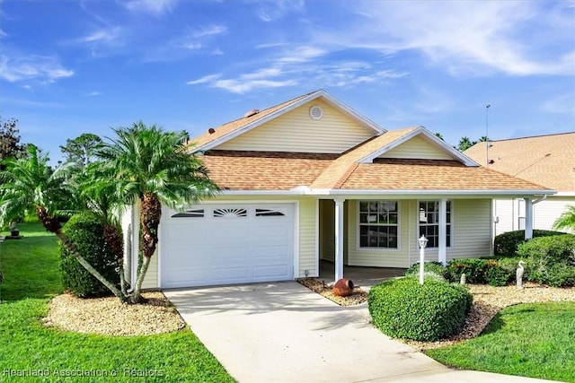 ranch-style home with a front lawn and a garage