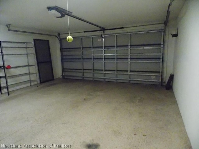 garage featuring a garage door opener