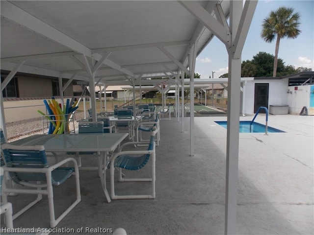 view of swimming pool with a patio