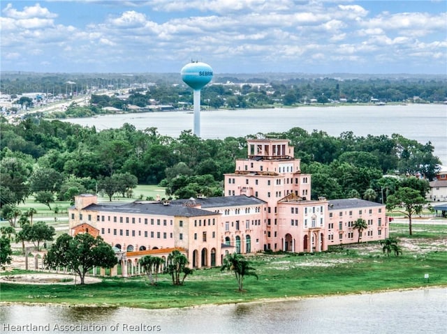 birds eye view of property with a water view