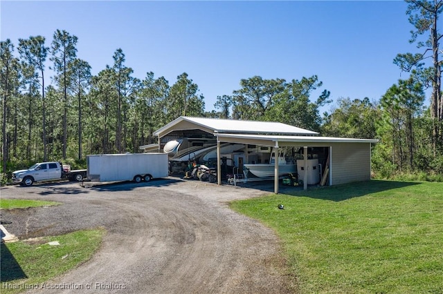 5931 Fig Rd, Sebring, FL 33875 - view of parking with dirt driveway and a carport