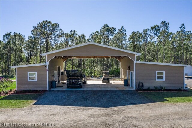 5931 Fig Rd, Sebring, FL 33875 - view of parking with a detached carport and aphalt driveway