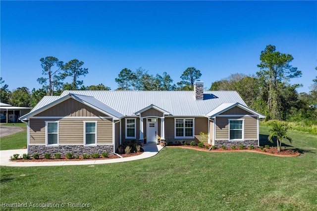 5931 Fig Rd, Sebring, FL 33875 - craftsman house featuring a chimney, stone siding, board and batten siding, and a front yard