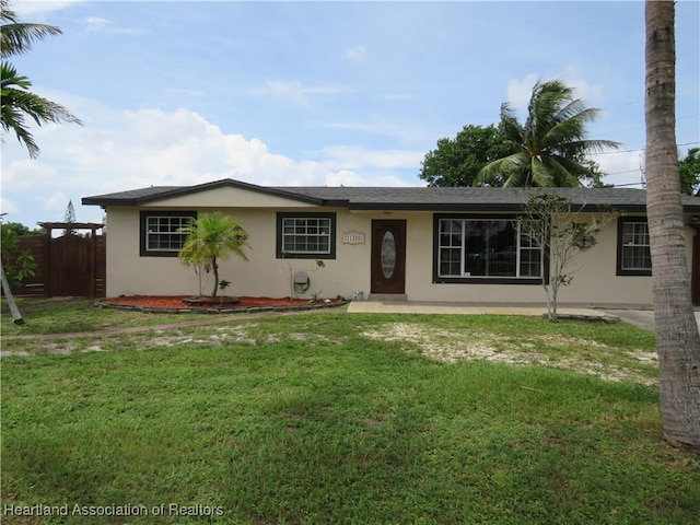 ranch-style house with a front yard