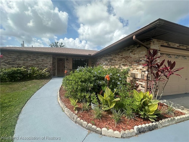 302 Whatley Blvd, Sebring, FL 33870 - entrance to property with brick siding and a garage