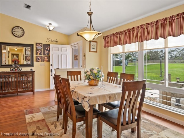 123 Harry Lee Rd, Lake Placid, FL 33852 - dining space featuring lofted ceiling and light hardwood / wood-style flooring