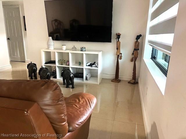 living room featuring light tile patterned flooring