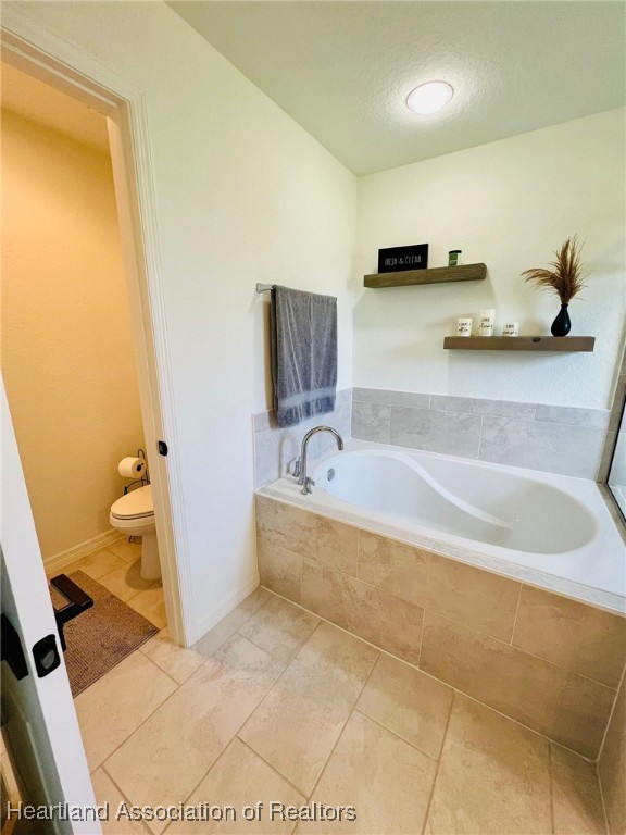 5310 Pebble Dr, Sebring, FL 33872 - bathroom featuring toilet and a bath