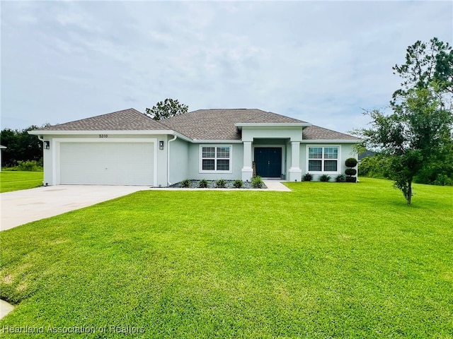 5310 Pebble Dr, Sebring, FL 33872 - view of front of property with an attached garage, concrete driveway, a front yard, stucco siding, and a shingled roof