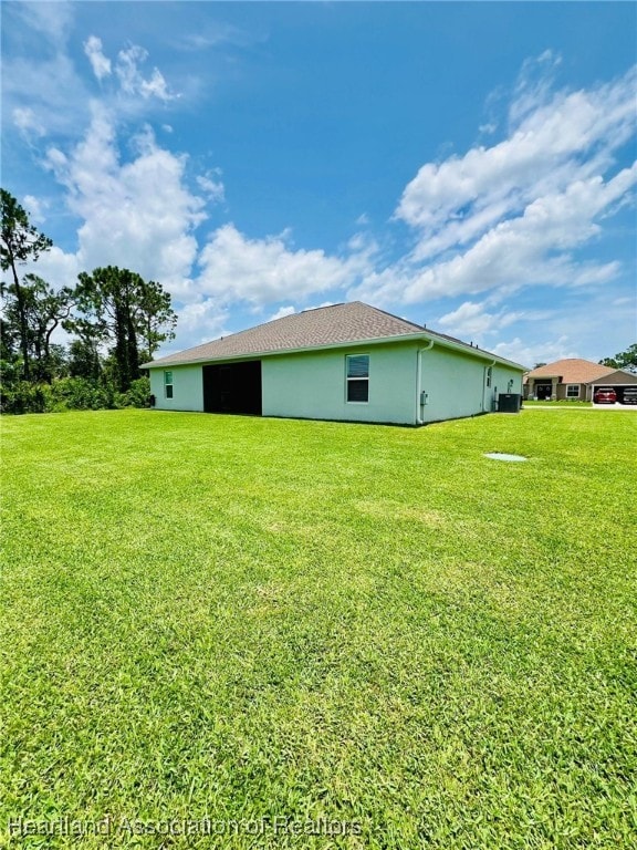 5310 Pebble Dr, Sebring, FL 33872 - view of home's exterior with a lawn and stucco siding