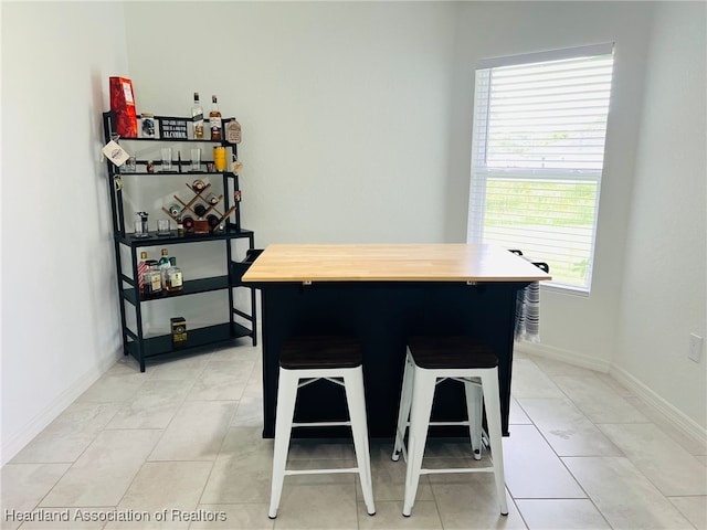 5310 Pebble Dr, Sebring, FL 33872 - dining room featuring baseboards and light tile patterned flooring
