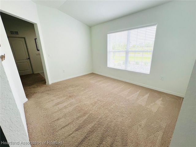 5310 Pebble Dr, Sebring, FL 33872 - empty room with light carpet and lofted ceiling