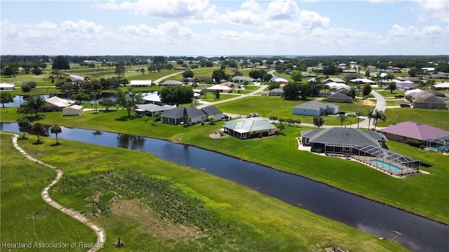 drone / aerial view with a residential view and a water view